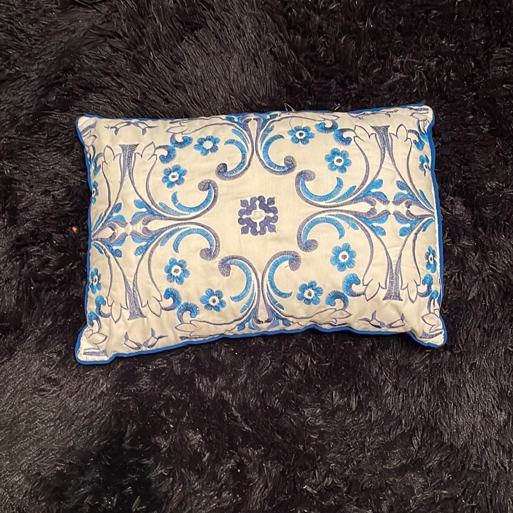 Patterned blue small pillow for bed